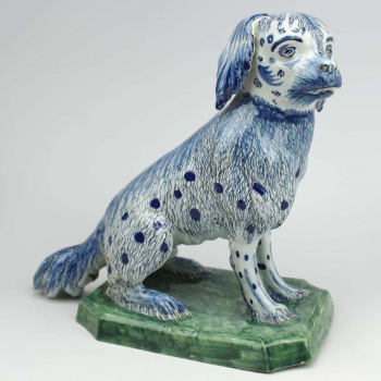 A large Delft pottery figure of a sitting dog