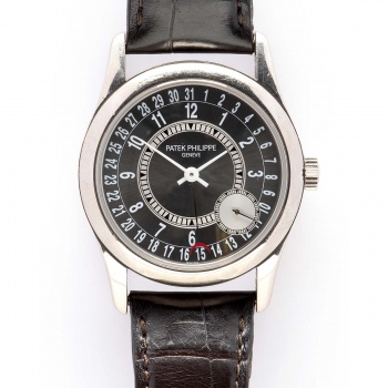 An 18k white gold gentlemen's wristwatch with date, by Patek Philippe